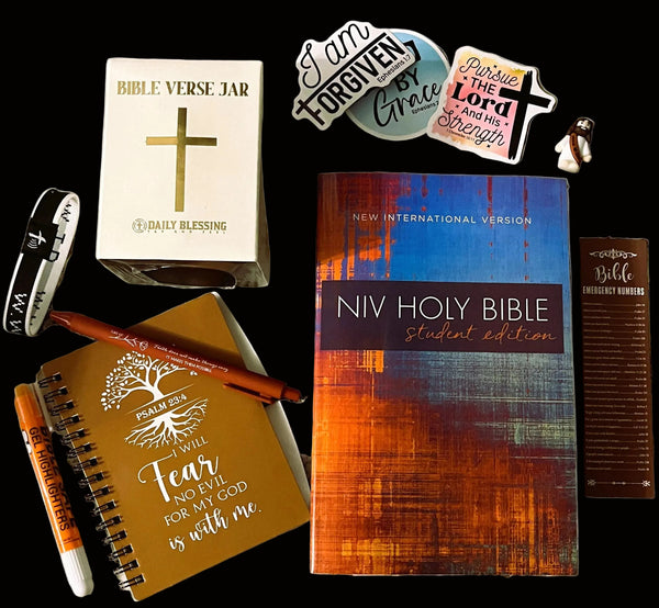 NIV Holy Bible Student Edition with accessories on a textured surface